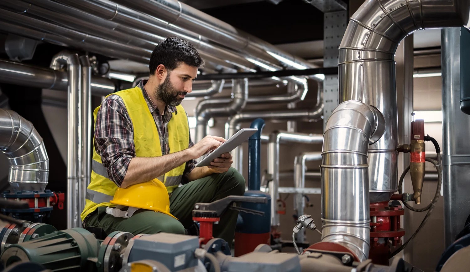 tech working on pipes