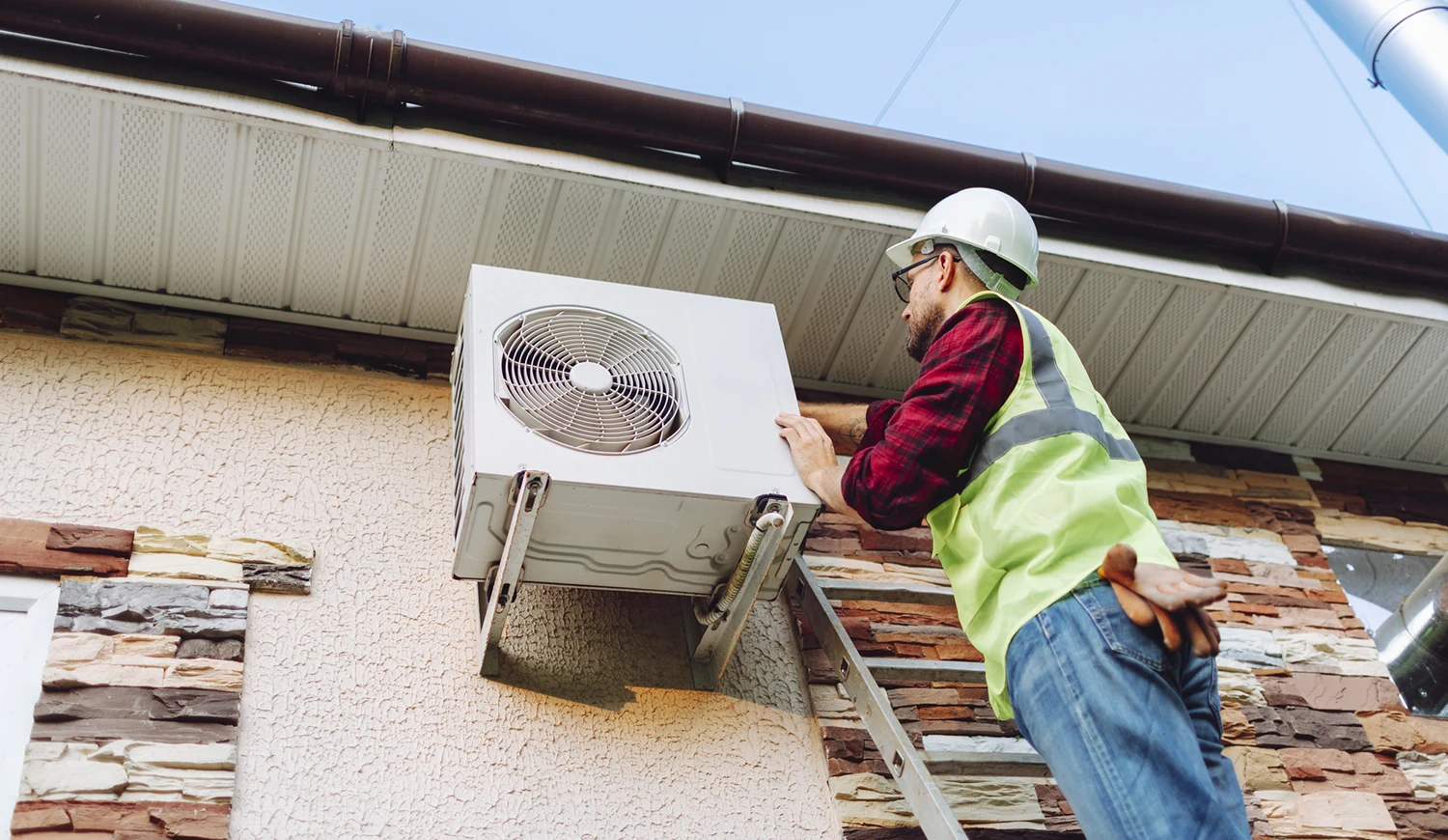 Tech repairing heat pump